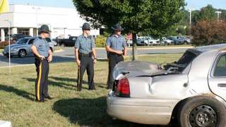 Illustration for article titled State trooper crashes into a new car dealership